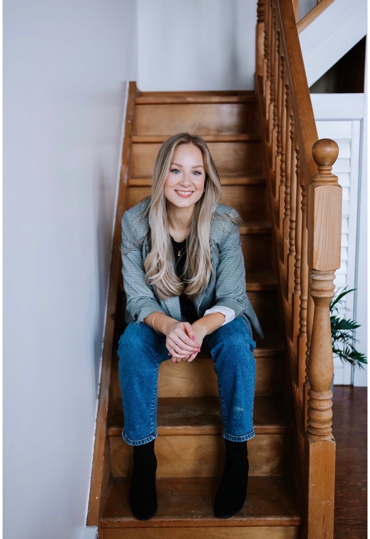 Vanessa Flis seated on a staircase